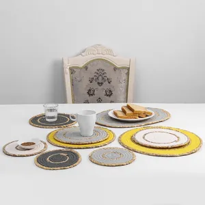 Detailed overhead view of assorted woven round and oval placemats in multiple sizes and colors