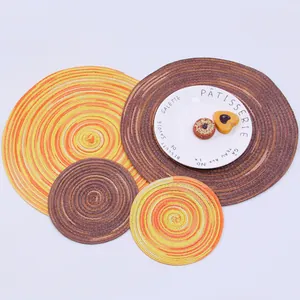 Detail of round woven ramie placemats showing spiral texture and heat-resistant material