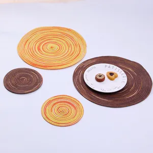 Detailed close-up of colorful round woven ramie placemats with spiral texture