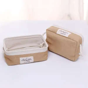 Detail of jute storage basket with white fabric lining and cotton rope handles