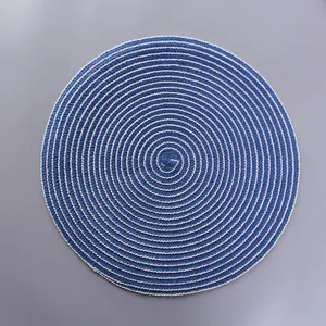 Detail of blue and white spiral woven cotton placemat with tight heat-resistant texture