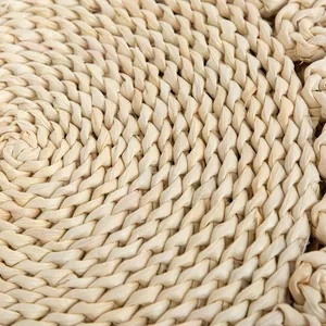 Macro shot of spiral woven corn husk heat resistant placemat showing natural texture