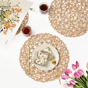 Detailed flat-lay of round hand-woven hollow paper rope placemat for table decoration
