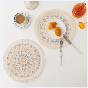 Macro detail of bohemian mandala coasters with fringe edges and geometric floral patterns