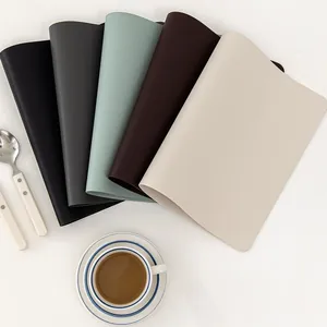 Detail of waterproof Morandi PU leather place mats showing texture and color variety