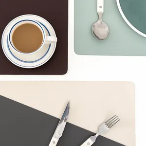 Close-up of waterproof heat-resistant leather placemats in multiple modern colors