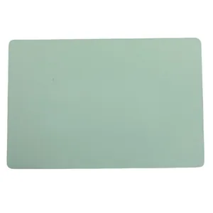 Waterproof light green PVC table mat with rounded corners on white background