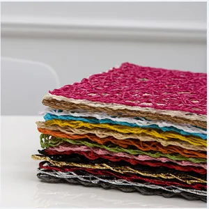 Detail showing various colors of handmade paper rope woven heat resistant placemats