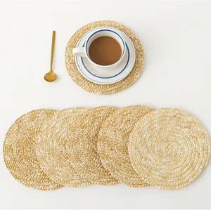 Set of round natural straw woven place mats and coasters for dining table insulation