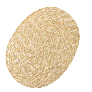 Oval handwoven heat-resistant placemat in natural beige and cream braided straw