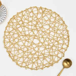 Handwoven gold round table mat with irregular mesh design for luxury dining decor