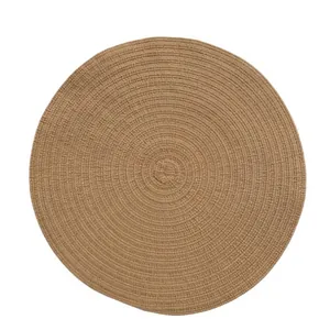 Minimalist round woven ramie placemat in natural tan for dining table heat protection