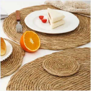 Handwoven round straw placemat and coaster set for heat resistant dining table protection