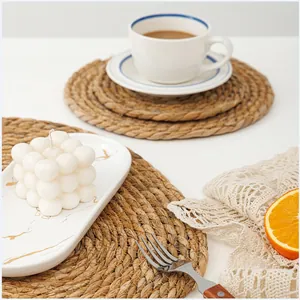 Macro shot of natural round woven seagrass placemats with detailed handmade texture