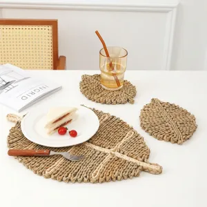 Handwoven leaf-shaped straw placemats set for natural heat-resistant dining table decor