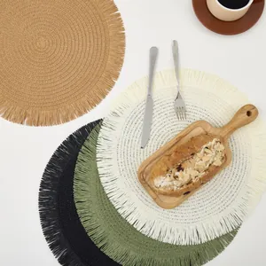 European woven round placemats with fringe edge in brown, black, green and beige tones