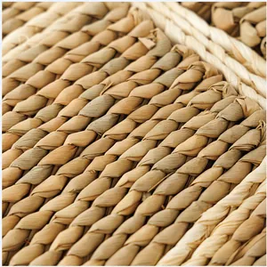 Macro detail of natural straw woven placemat showing intricate texture and handmade craft