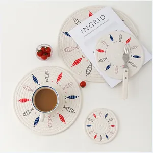 Nordic woven cotton round placemats with fish print in various sizes for dining table decor