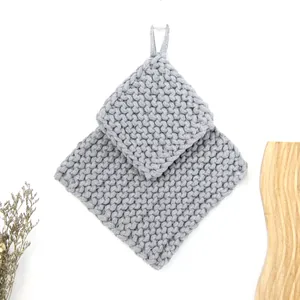 Thick grey hand-woven cotton rope place mats set with hanging loops and honeycomb texture