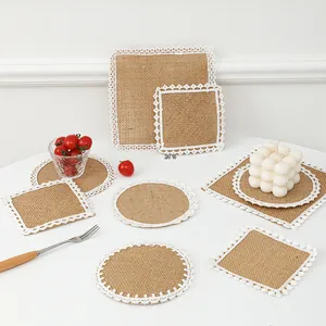 Detailed view of assorted jute placemats with white lace edges for dining table decor