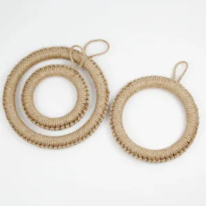 Detail of three sizes of handmade woven jute heat resistant pot mats with hanging loops