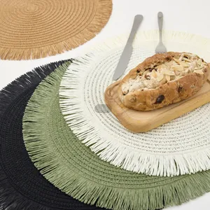 European minimalist woven round placemats with fringe in four neutral colors