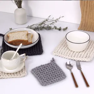 Thick square woven cotton placemats in black, beige and grey with hanging loops