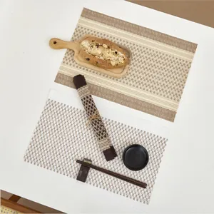 Minimalist woven placemats in stripe and geometric patterns for heat-resistant dining table decor