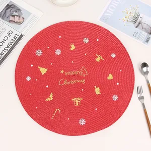 Red woven Christmas placemat with Merry Christmas embroidery and festive holiday patterns