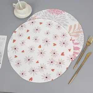 Set of round woven table mats with floral patterns and heat insulation for dining decor