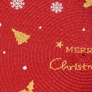 Red Christmas woven placemat featuring golden Merry Christmas embroidery and festive tree