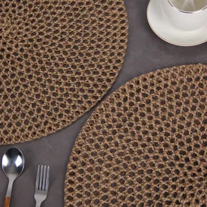 Set of two round jute woven placemats for dining table heat insulation and rustic decor