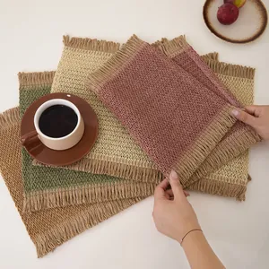Rectangular woven table placemat set with decorative fringe in various pastel colors