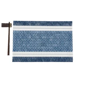 Blue and white woven rectangle placemat with geometric patterns for heat resistant dining
