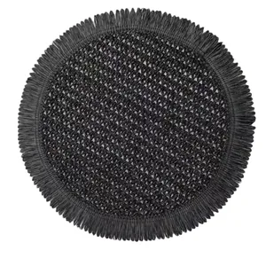 Japanese style black woven round placemat with fringe tassels and boho weave texture