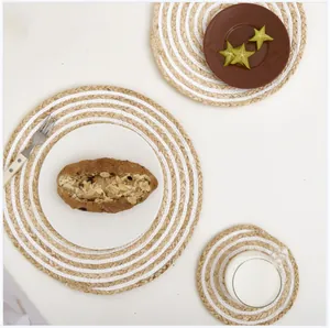 Handwoven round heat-resistant placemats in natural fiber and white cotton spiral design