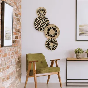 Set of 4 woven grass wall plates with geometric black and natural straw patterns