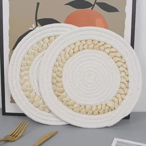 Minimalist round woven placemats set made of cotton rope and natural straw for table protection