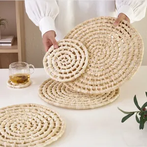 Detail of natural corn husk placemats showing round woven textures and various sizes