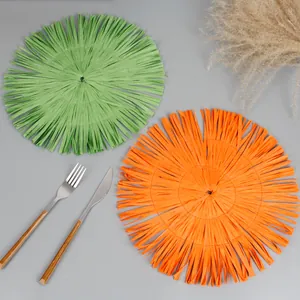 European style round paper woven placemat with tassels in green and orange colors