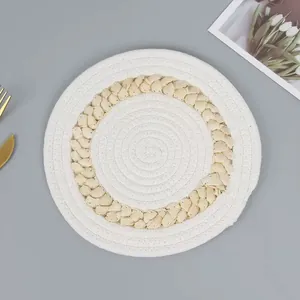 Nordic round cotton and straw woven placemat with minimalist heat resistant design