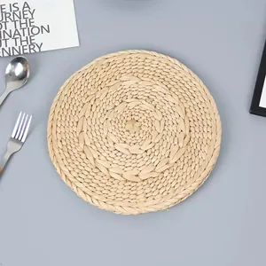 Handwoven round natural straw placemat with heat resistance for dining table decor