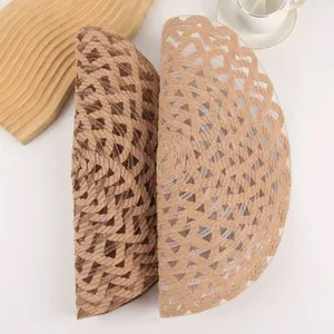 Minimalist round ramie placemats in dark brown and beige with spiral woven design