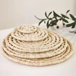 Natural corn husk woven round placemats set for dining table and rustic wall decor