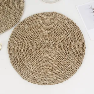 Thick circular hand-woven seagrass placemat with heat-resistant natural spiral fibers