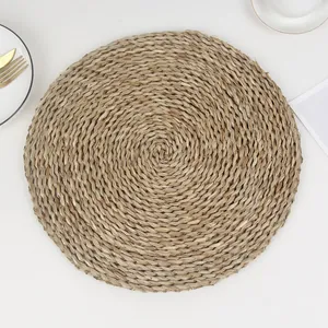 Natural round seagrass placemat with thick woven texture for rustic table decoration