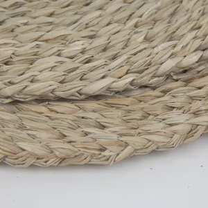 Macro view of thick woven seagrass placemat showing natural texture and durable braiding