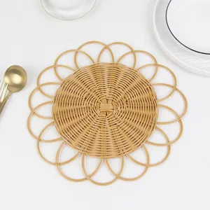 Detail of round woven placemat with hollow edge design and sunflower shape texture