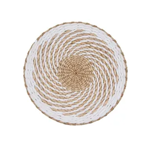 Minimalist woven round wall decor handcrafted with natural fiber in white and beige spiral