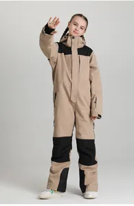 Detail of big kids one-piece ski suit featuring windproof hood and multi-pocket design